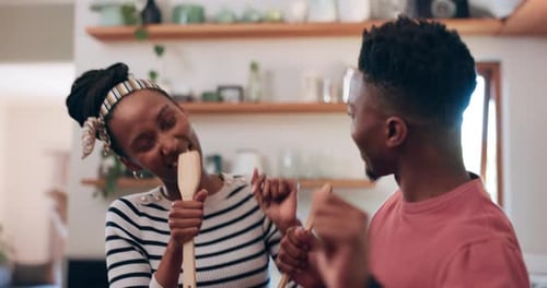 Playful Couple Dancing Together in Kitchen