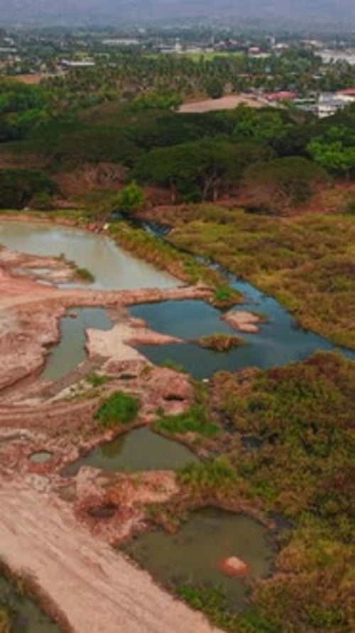 Water Accumulating in Excavated Areas Near Ban Bang Phra Thailand Creating Small Ponds and Altering