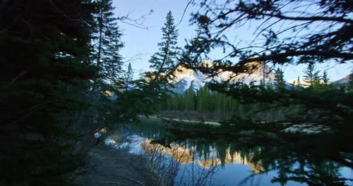 mountains tower over creek