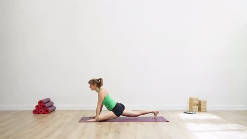 Woman in calm leg lift on yoga mat