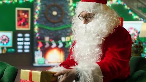 Man Dressed as Santa Claus with Christmas Gift