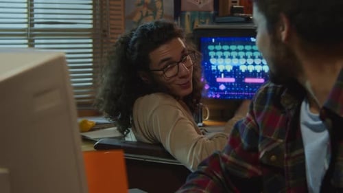 Young Men Working In Old-Fashioned Garage Office