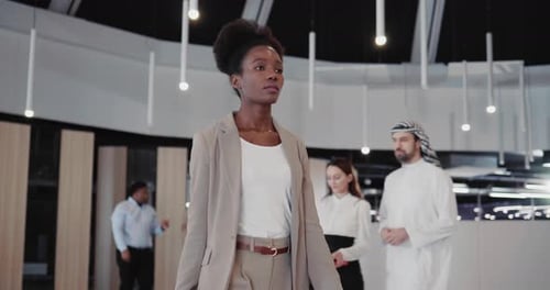 Confident Afroamerican Elegant Female Executive Walking Into Office Cabinet Through Corporate