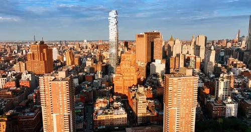 Bright sun lighting the diverse dense architecture of New York.