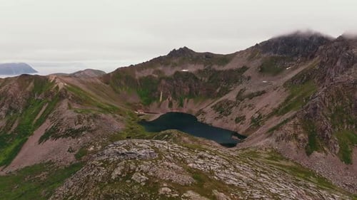 Beautiful Large Lake with a Reflection of the Sky Between Green Fjords in Norway View From Above