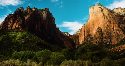 Epic Canyon Mountain Peaks Under Bright Blue Sky and Sunlight