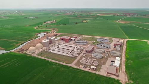 Aerial Drone View of Modern Water Treatment Plant in Green Valley, Clean Environment Concept