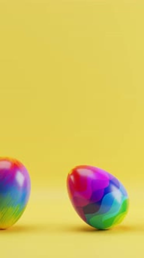 Colorful Easter Eggs Rolling on a Bright Yellow Background