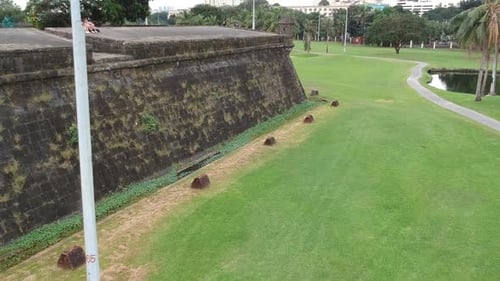 Footage of drone flying next to the historical wall of Intramuros in Manila