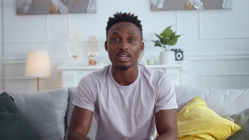 Young Man Talking to Camera, Couch Setting