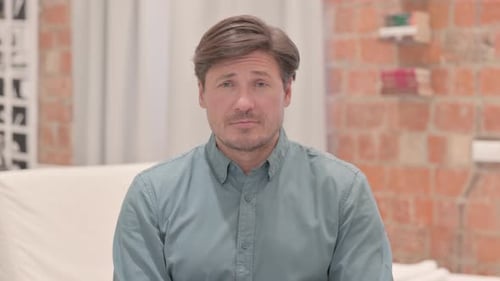 Portrait of Brainstorming Mature Adult Man with New Idea