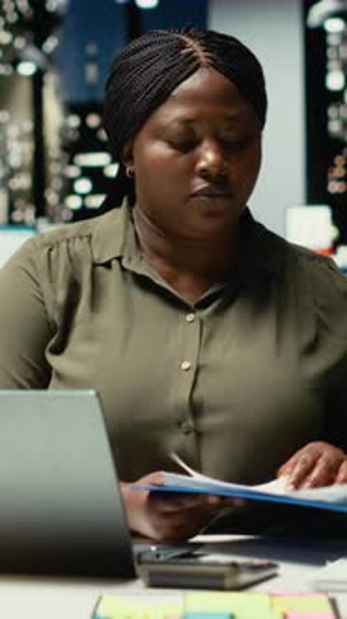 Vertical Video Engaged General Manager Researching Market Data and Designing Strategies