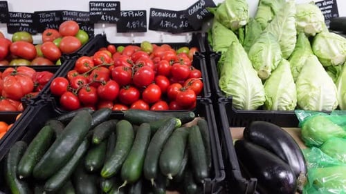 Various types of fruits and vegetables for sale at a market