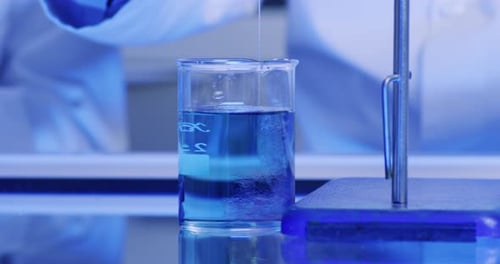 Closeup of a medical research experiment in a chemistry lab of color changing liquid