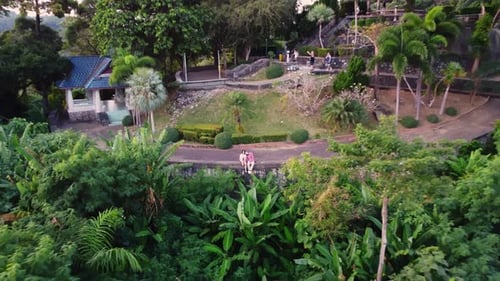 Lovely Couple is Sitting on Border of National Park Located on the Mountain in Front of Precipice