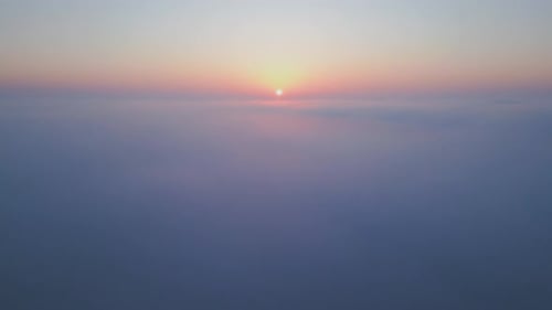 Sunrise Above a Vast Sea of Clouds The Golden Light Gently Illuminates the Misty Sky Creating a