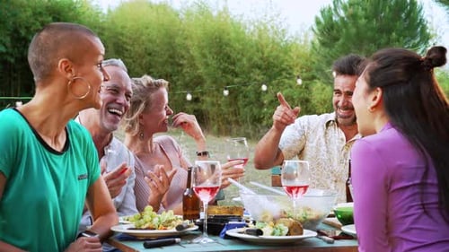 Friends Gather and Laugh During Outdoor Meal