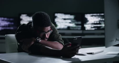 Black man, smartphone and office at night, exhausted and scrolling on social media