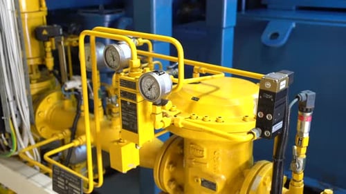 gas station with yellow pipes with indicators. Industrial interior.