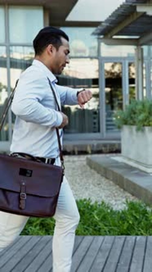 Businessman, watch or rush with bag for late schedule, deadline or work crisis in city