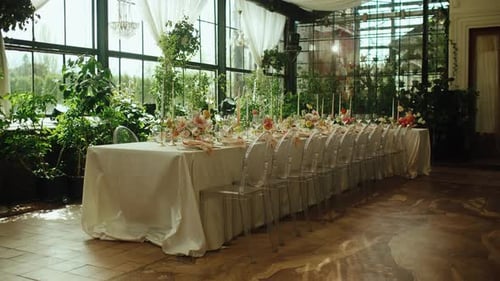 Wedding Reception Table Setting with Flowers and Candles