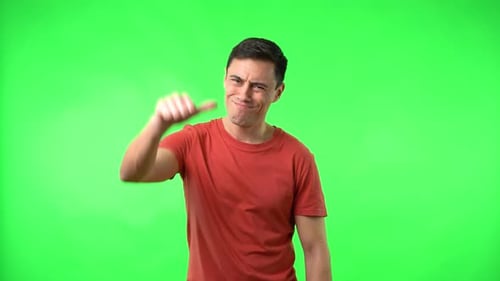 Man Giving Thumbs Down on Green Screen