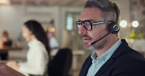 Man Talking with Headset in Office Environment