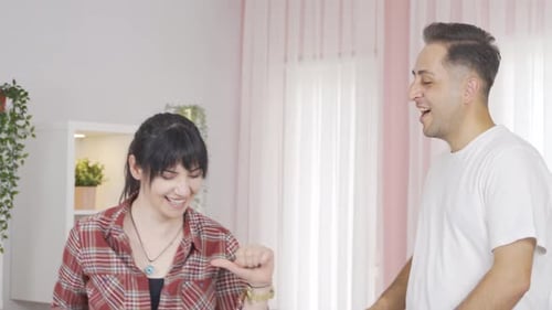 Couple dancing in a fun way.