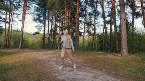 Blonde Woman Exercising in a Sunny Forest