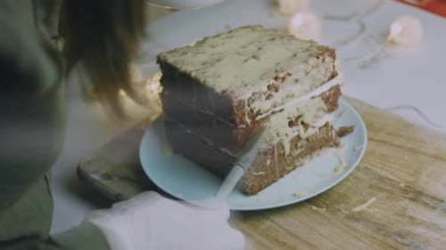 I Spread the Cream on the Square Cake Crusts Christmas Atmosphere with Lights in the Background