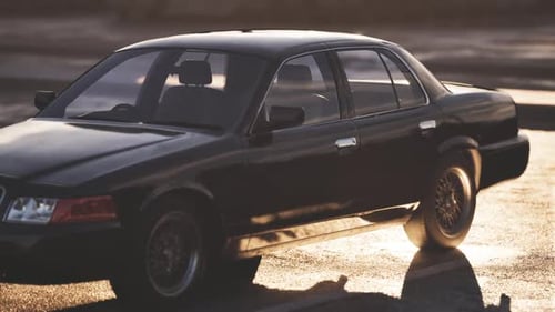 Black Sedan with Dynamic Golden Light Reflections