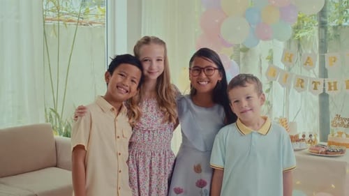Smiling Children Celebrating a Birthday Party