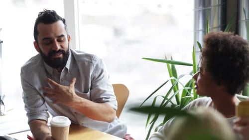 Office Colleagues Chatting During a Casual Break