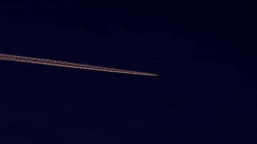 Airplane Flying with Contrail.