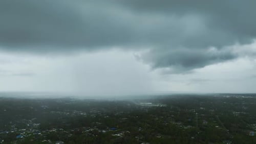 Landscape of Dark Ominous Clouds Forming on Stormy Sky During Heavy Thunderstorm Over Rural Town