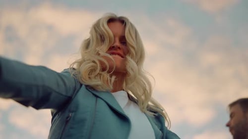 Bottom View Happy Girl Dancing For Camera At Rooftop Party. Closeup Pretty Woman Jumping On The S...