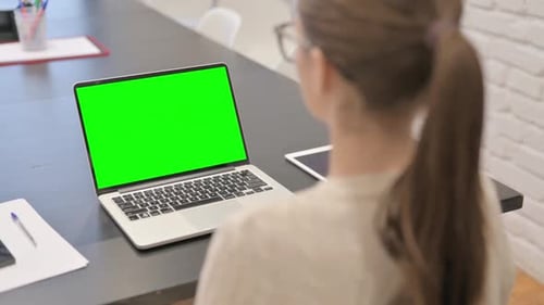 Working on Laptop with Green Screen