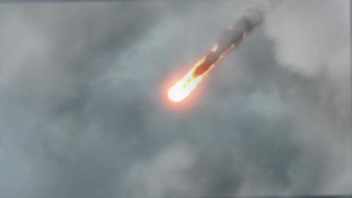 Dramatic Burning Meteor Streaking Through Clouds