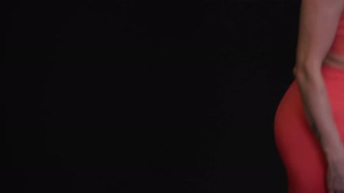 Woman with Red Hair Posing with Exercise Equipment