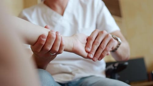 Health Professional Manipulating Patient's Wrist