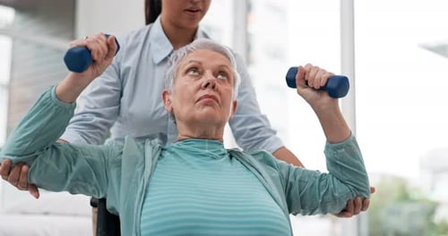 Senior Woman Doing Physical Therapy with Dumbbells