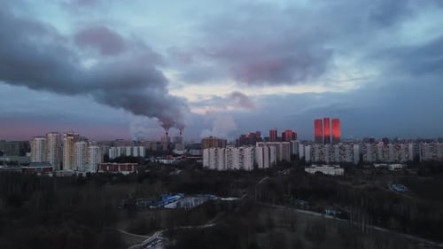 Thick Smoke From the Chimneys of Factories Against the Background City