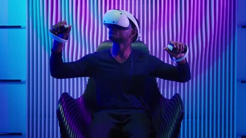 Adult Using Futuristic VR Headset and Controllers