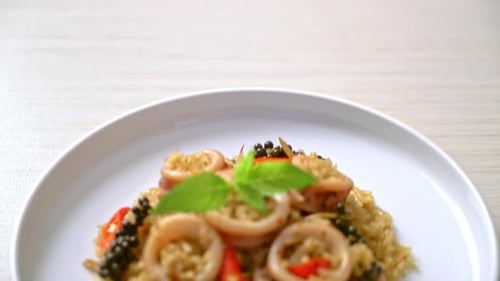 Fried Rice with Squid Rings on White Plate