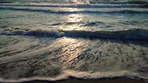 Sea Waves Rolling on Sandy Shore Beach on Sea Coast Dawn Sunset Blue Sea Waves