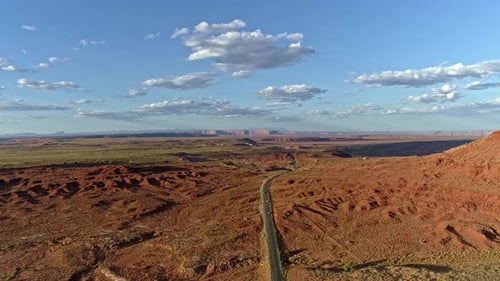 Spectacular landscapes on a road trip through monument valley on long straight highways in Arizona a