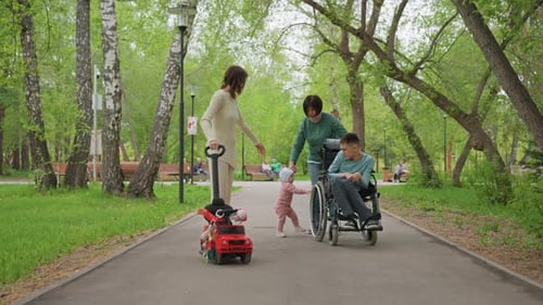Family Enjoying Time Together in a Green Park