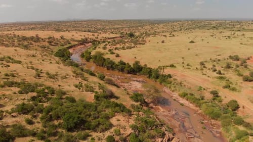 A river going through samburu/maasai land in Kenya. Aerials shots.