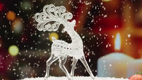 Sparkling Reindeer Figurine with Falling Snow and Candlelight