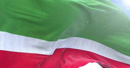 Waving Green White Red Flag Against Sunny Sky